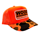 An orange camo trucker hat with a Wood is Wonderful Phillips Forest Products patch