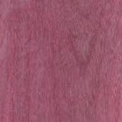 Close-up view of a piece of Purple Heart lumber displaying its wood grain and purple hue.