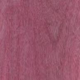 Close-up view of a piece of Purple Heart lumber displaying its wood grain and purple hue.