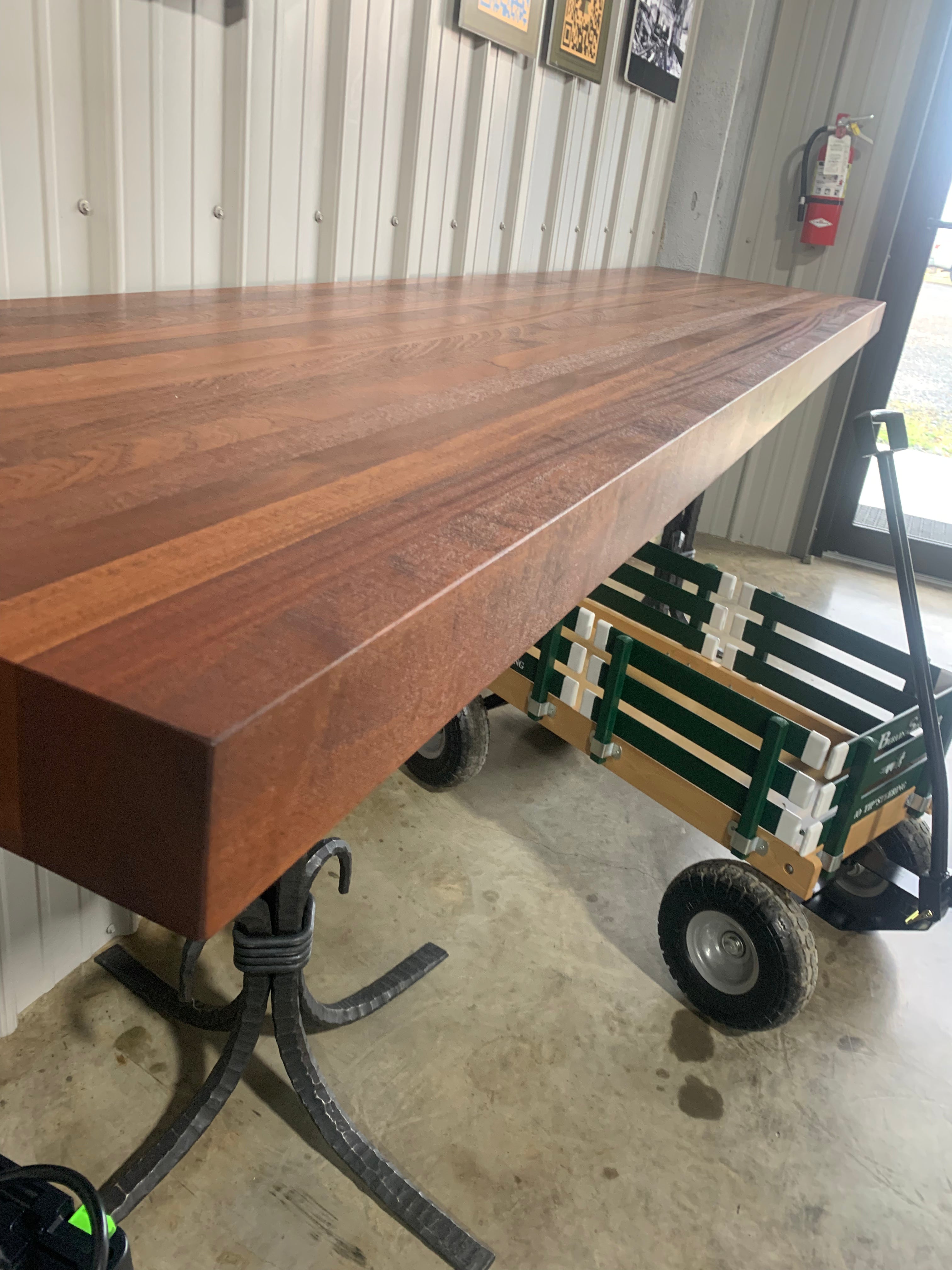 Finished Sapele wood slab with rich reddish-brown tones and ribbon-like grain pattern.
