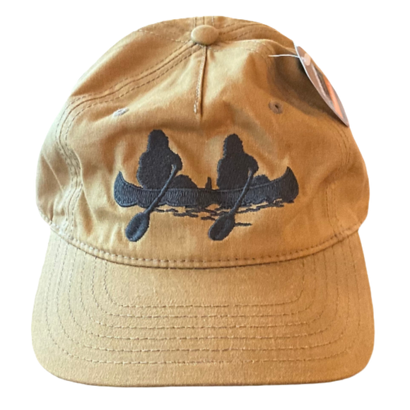 A khaki hat with a sasquatch in a canoe design