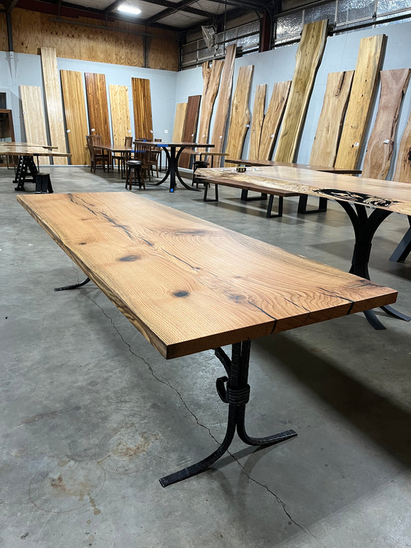 Square edge red oak wood slab with rich grain patterns, natural knots, and kiln-dried hardwood surface for custom furniture or table making.
