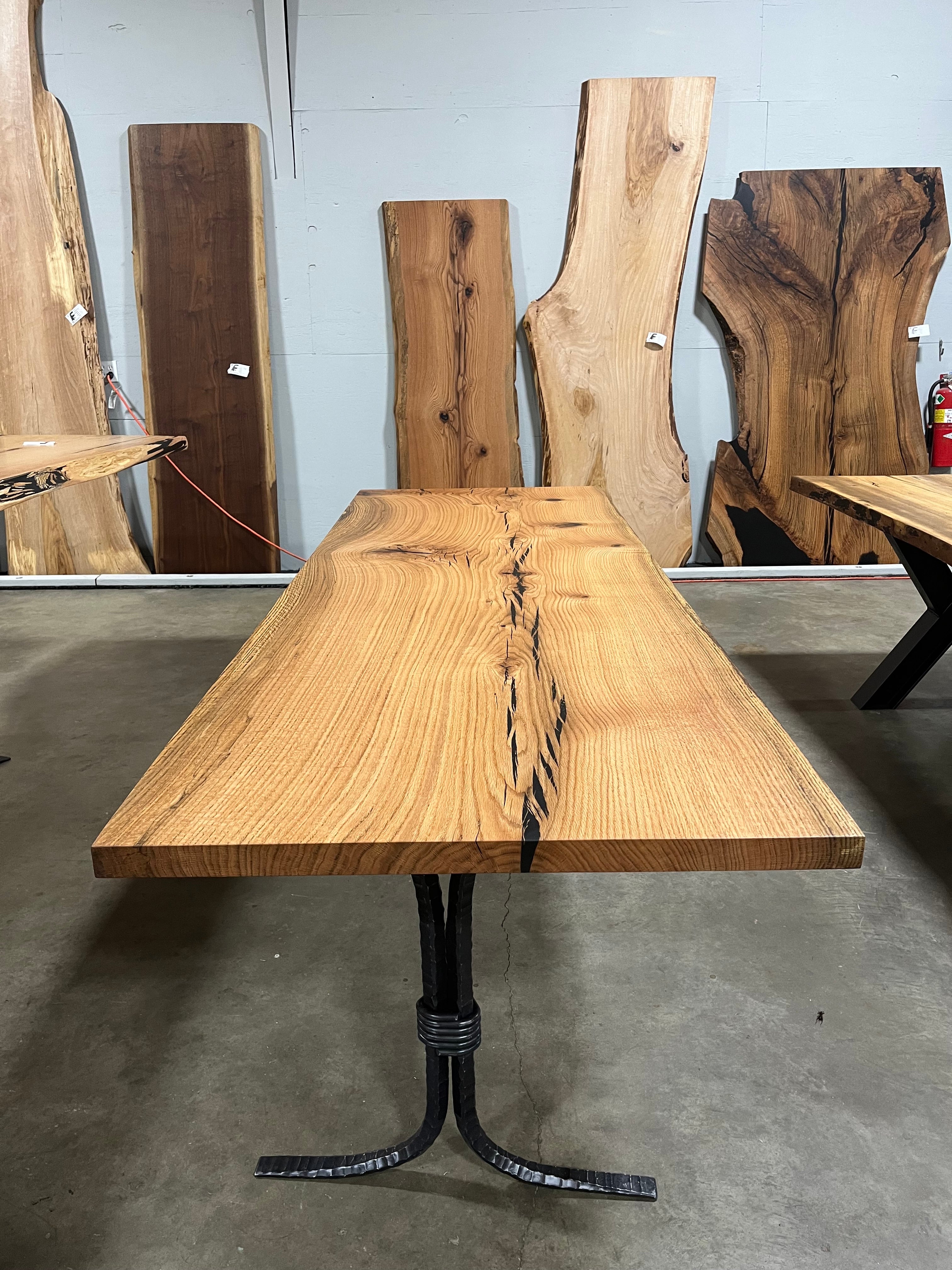 Square edge red oak wood slab with rich grain patterns, natural knots, and kiln-dried hardwood surface for custom furniture or table making.
