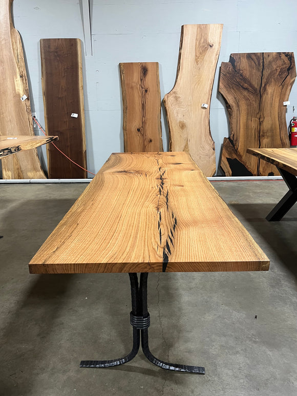 Square edge red oak wood slab with rich grain patterns, natural knots, and kiln-dried hardwood surface for custom furniture or table making.
