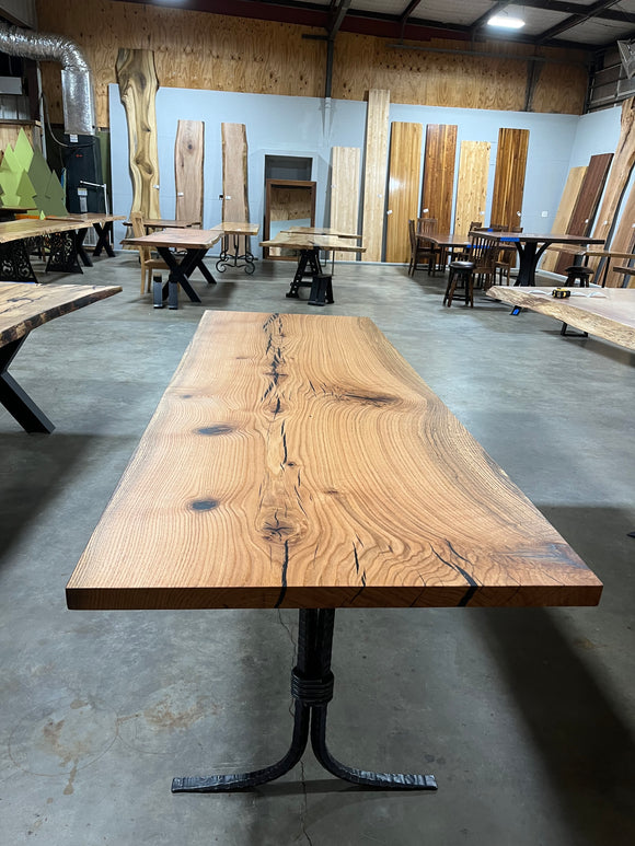 Square edge red oak wood slab with rich grain patterns, natural knots, and kiln-dried hardwood surface for custom furniture or table making.
