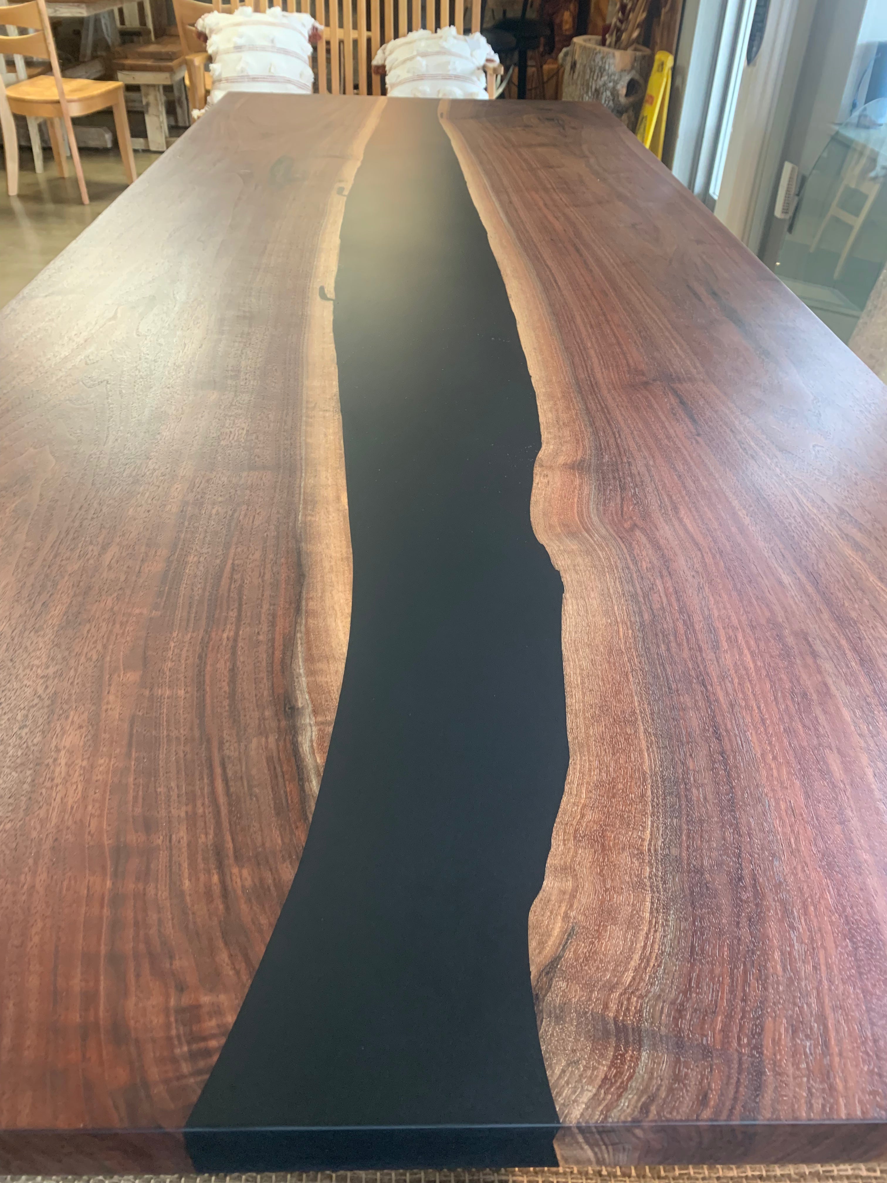 Modern walnut table with epoxy river detail and square edge finish