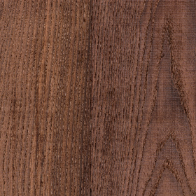 Close-up view of a piece of thermally modified ash lumber displaying its wood grain.