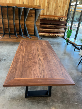 Walnut Plank Top Slab with rich brown grain and live-edge design, supported by black steel legs.