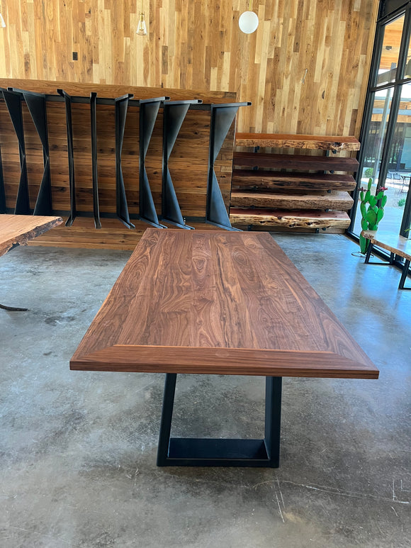 Walnut Plank Top Slab with rich brown grain and live-edge design, supported by black steel legs.