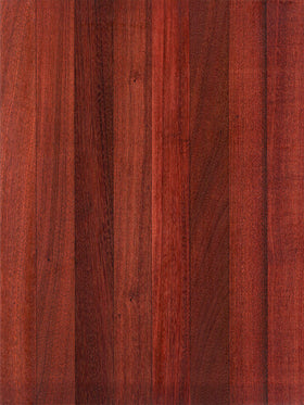 A close-up image of a sapele wood cutting board showing the wood grain and rich color.