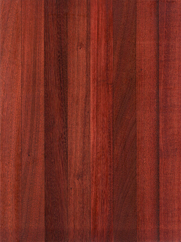 A close-up image of a sapele wood cutting board showing the wood grain and rich color.