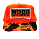 Orange cap with 'Wood is Wonderful' patch and camouflage pattern on a white background