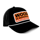 Black cap with an orange "Wood is Wonderful" Phillips Forest Products patch.