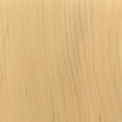Close-up view of a piece of yellow heart lumber displaying its wood grain.