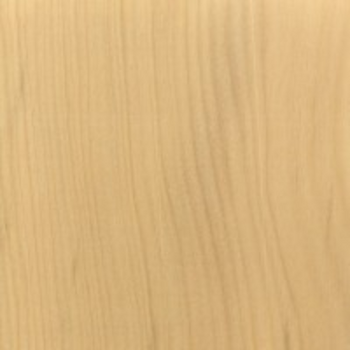 Close-up view of a piece of yellow heart lumber displaying its wood grain.
