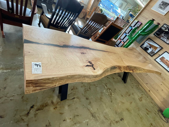 Live edge pecan slab with rich golden-brown tones, natural grain patterns, and organic edges