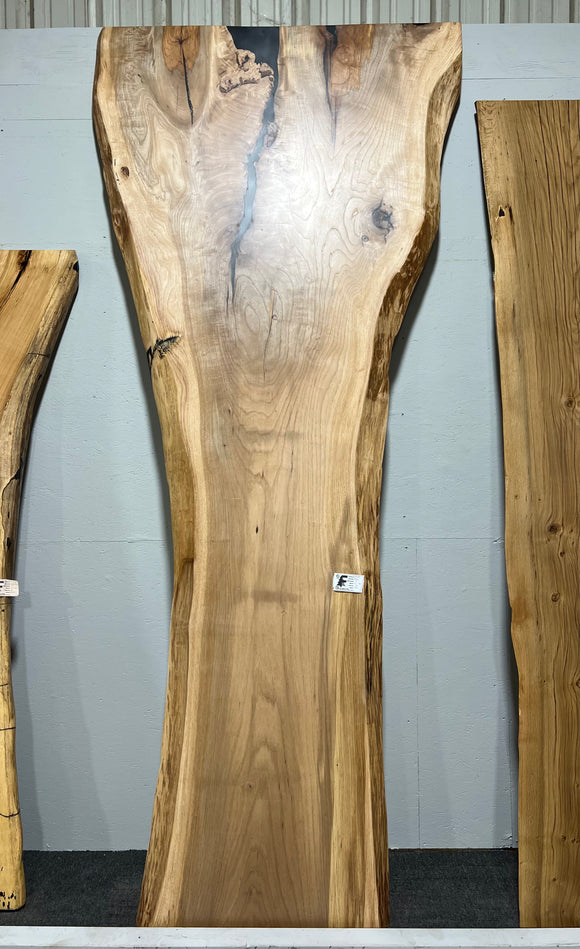 Live edge pecan slab with rich golden-brown tones, natural grain patterns, and organic edges