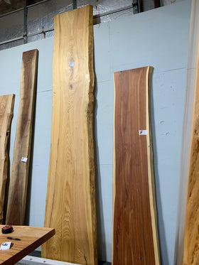 Natural cypress wood slab with rich grain patterns and live edge, perfect for custom dining tables or countertops
