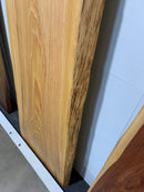 Natural cypress wood slab with rich grain patterns and live edge, perfect for custom dining tables or countertops